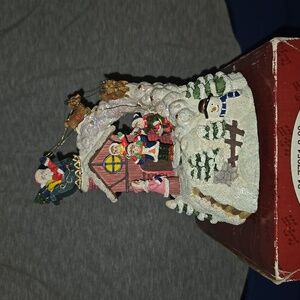 Village with Santa and sleigh music box. Plays; Santa Claus is coming to town.